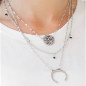 Lunar Lotus layered silver tone necklace set.
